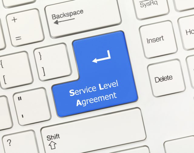 Keyboard return button highlighted in blue with the words Service Level Agreement printed on to it